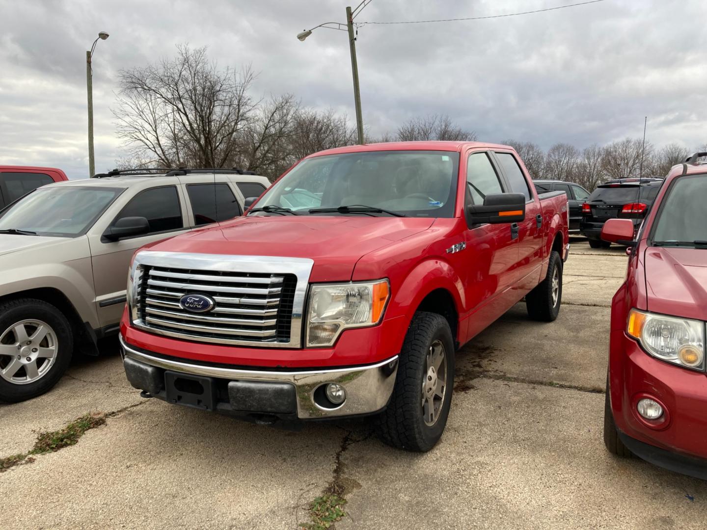 2010 Vermillion Red Ford F-150 Lariat SuperCrew 5.5-ft. Bed 4WD (1FTFW1EV9AF) with an 5.4L V8 SOHC 24V FFV engine, 4-Speed Automatic transmission, located at 1800 South Ihm Blvd, Freeport, IL, 61032, (815) 232-5543, 42.278645, -89.607994 - Photo#0